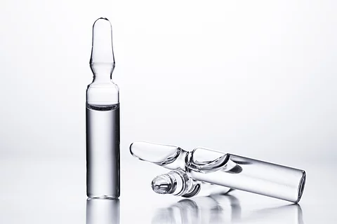 Medical ampules for injections on a white background.