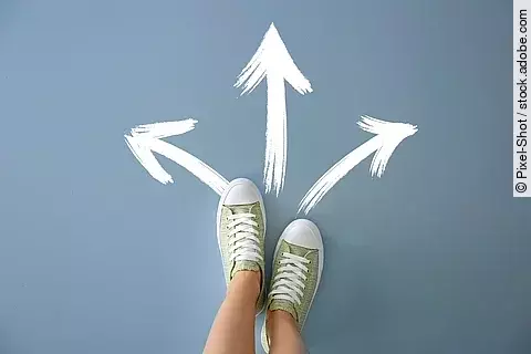 Woman standing on color background with arrows pointing in diffe