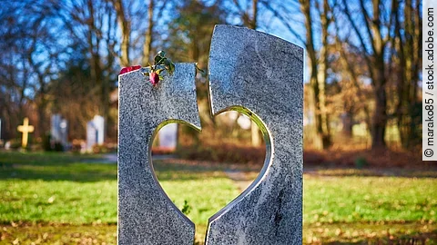 Gravestone with heart withered rose / Tombstone with heart on graveyard