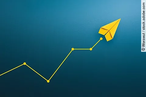 Yellow paper plane, volatility in the business and investment