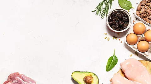 Fresh organic food for low carb keto diet on white marble background long banner format, copy space for your design. Healthy lifestyle and weight loss concept.