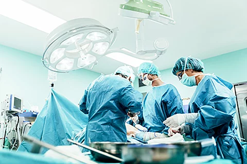 Team of Surgeons Operating.