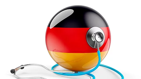 Deutsch flag with stethoscope. Health care in Germany concept, 3D rendering