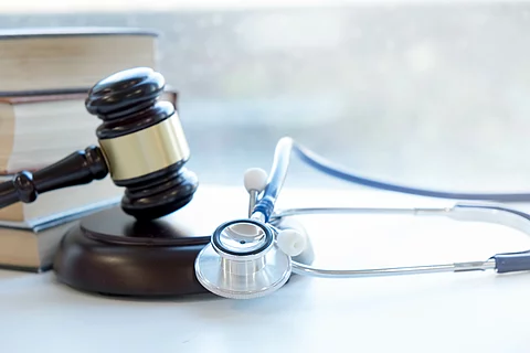 Gavel and stethoscope. medical jurisprudence. legal definition of medical malpractice. attorney. common errors doctors, nurses and hospitals make Hammer und Stethoskop