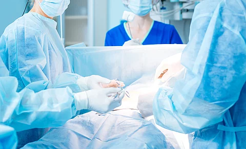 Serious doctor looking at her assistant