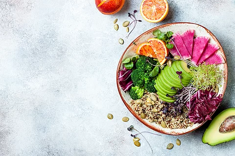 Vegan, detox Buddha bowl with quinoa, micro greens, avocado, blo
