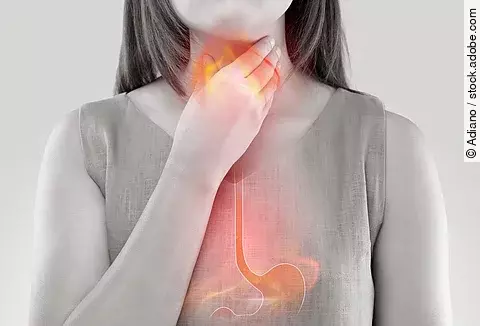 Woman Suffering From Acid Reflux Or Heartburn-Isolated On White 