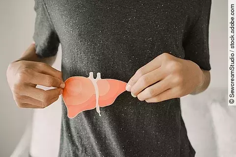 Man holding liver, hepatitis vaccination, liver cancer treatment