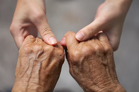 hands of old and young woman 