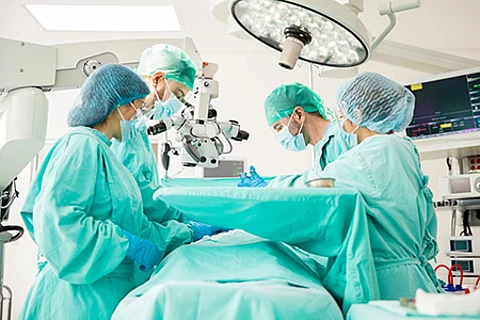 Surgeons working on a patient